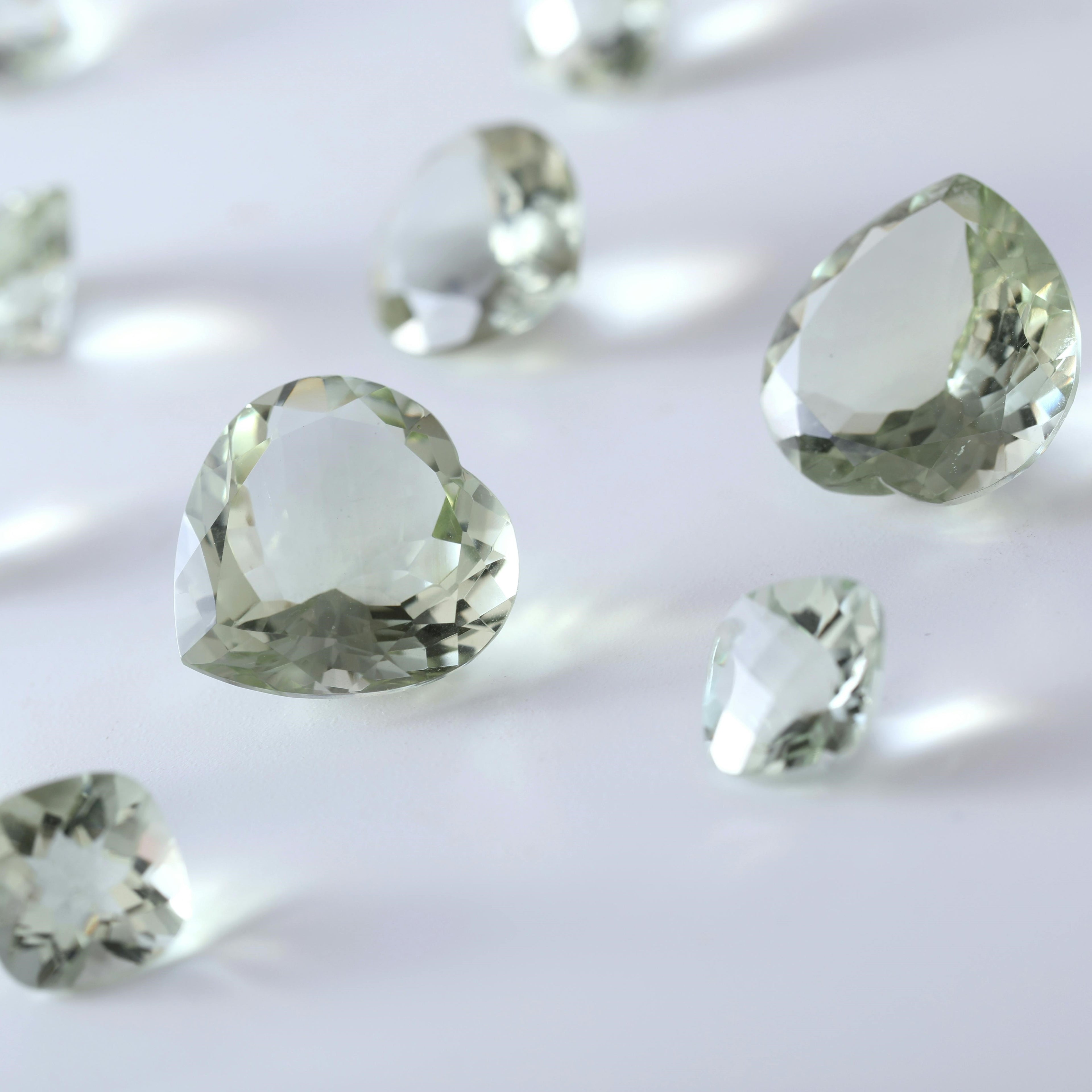 Green gemstones on a white background